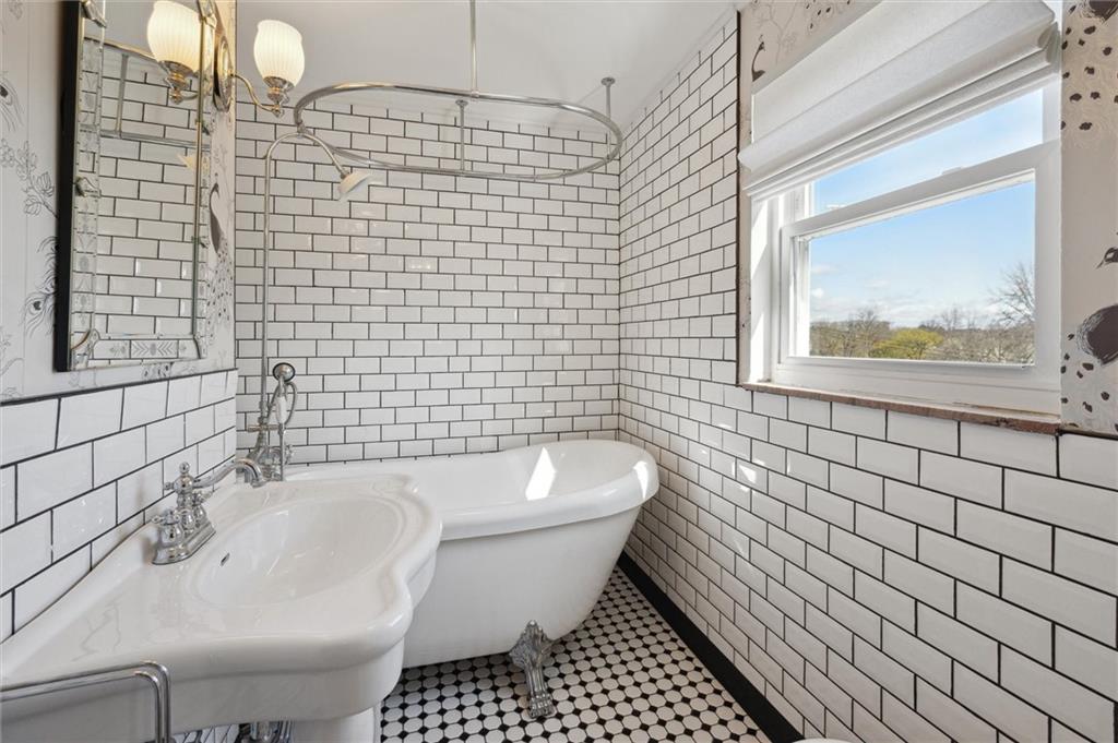 2936 Brodhead Road Aliquippa, PA 15001 - Photo 25 of 47 a bathroom with a sink and bathtub