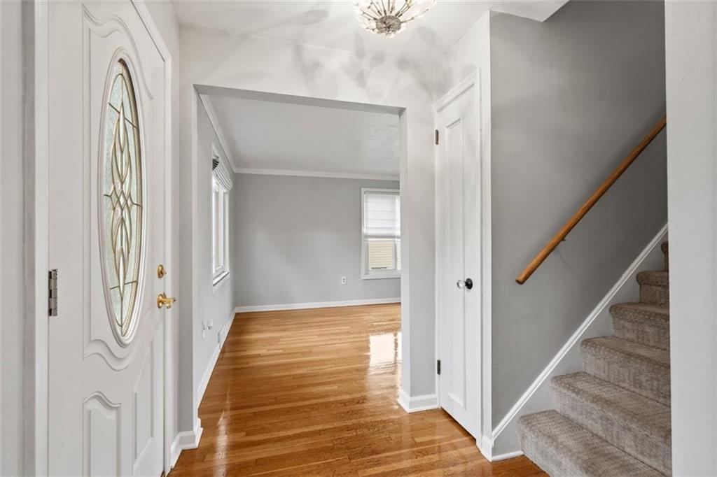 2936 Brodhead Road Aliquippa, PA 15001 - Photo 4 of 47 a view of a hallway with wooden floor and staircase