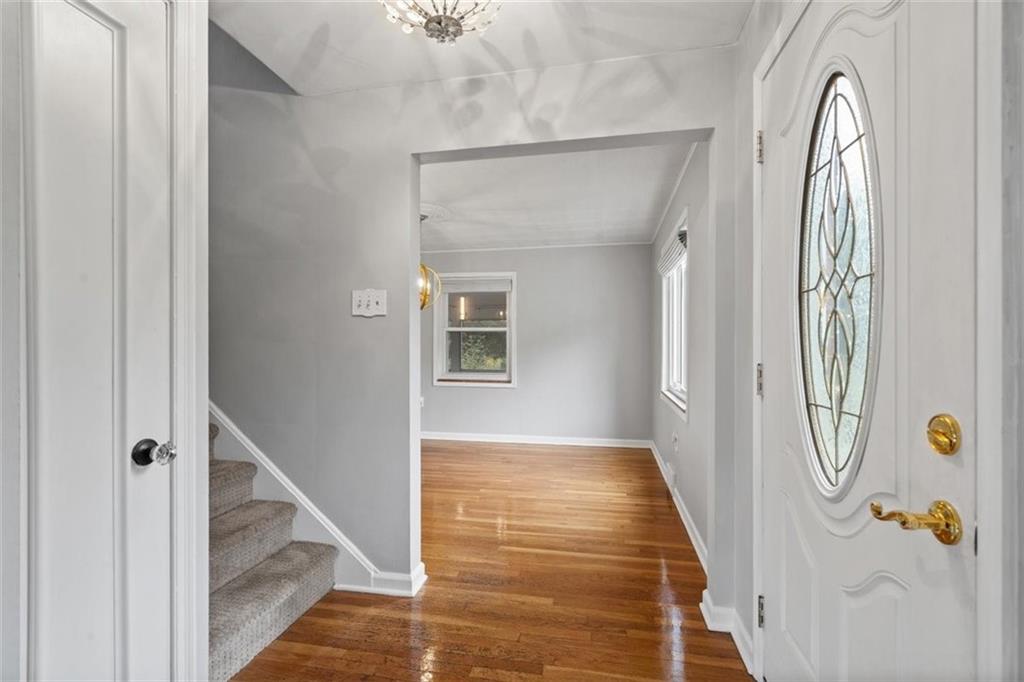 2936 Brodhead Road Aliquippa, PA 15001 - Photo 10 of 47 a view of a hallway with wooden floor and staircase