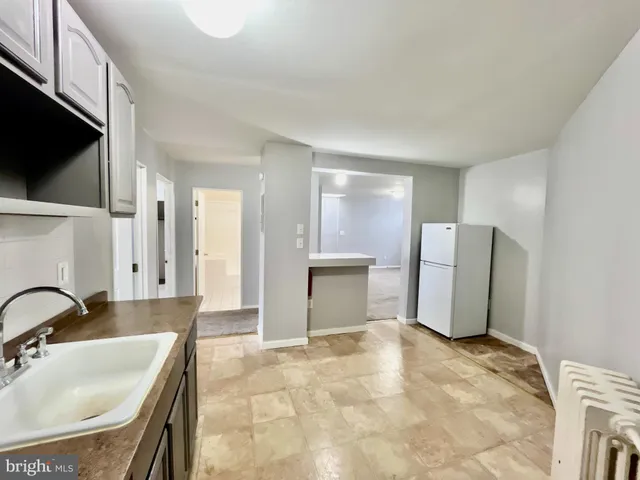 a bathroom with a sink double vanity and a mirror