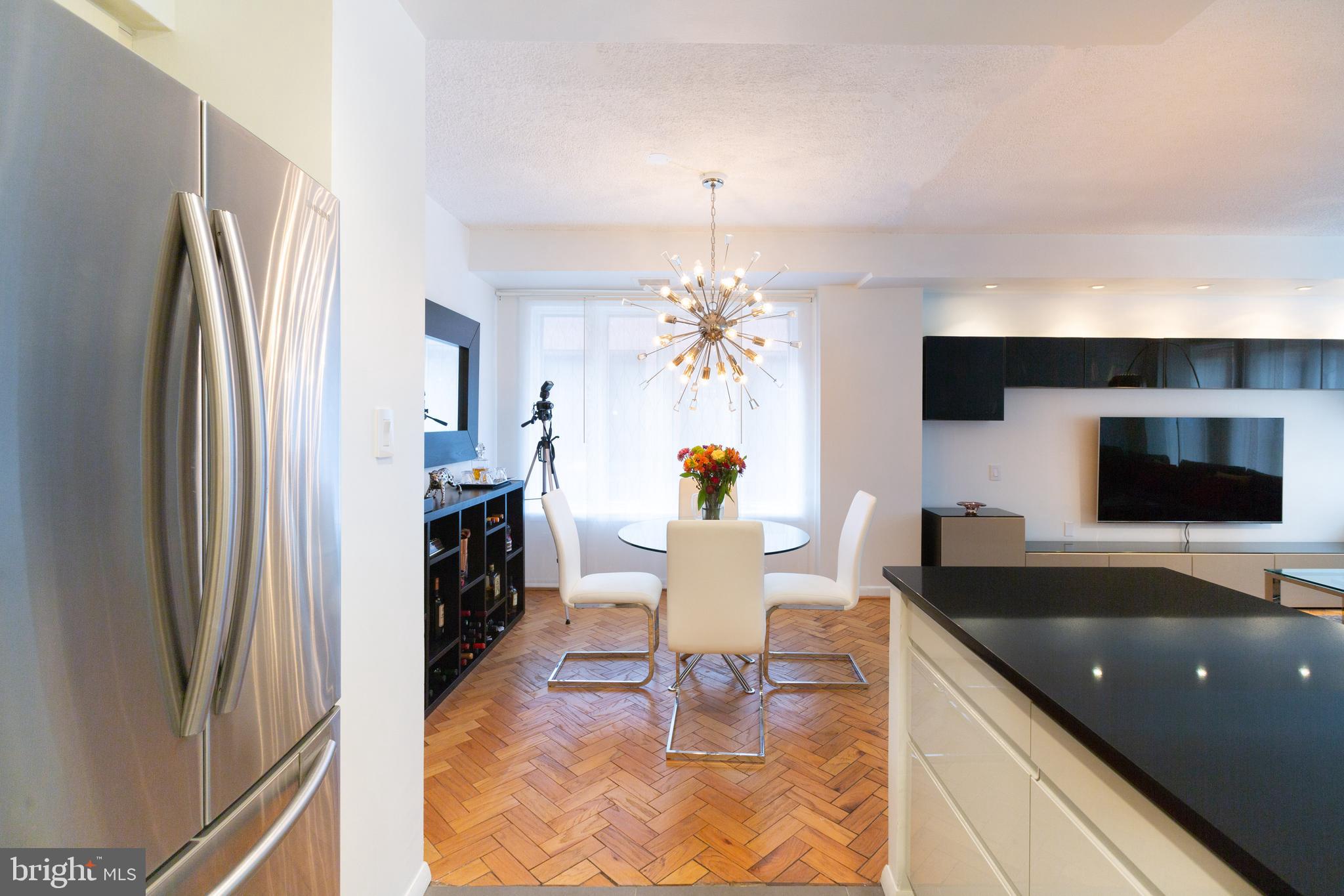 1045 31st Street Northwest, Unit 21 Washington, DC 20007 - Photo 22 of 35 a living room with furniture and a flat screen tv