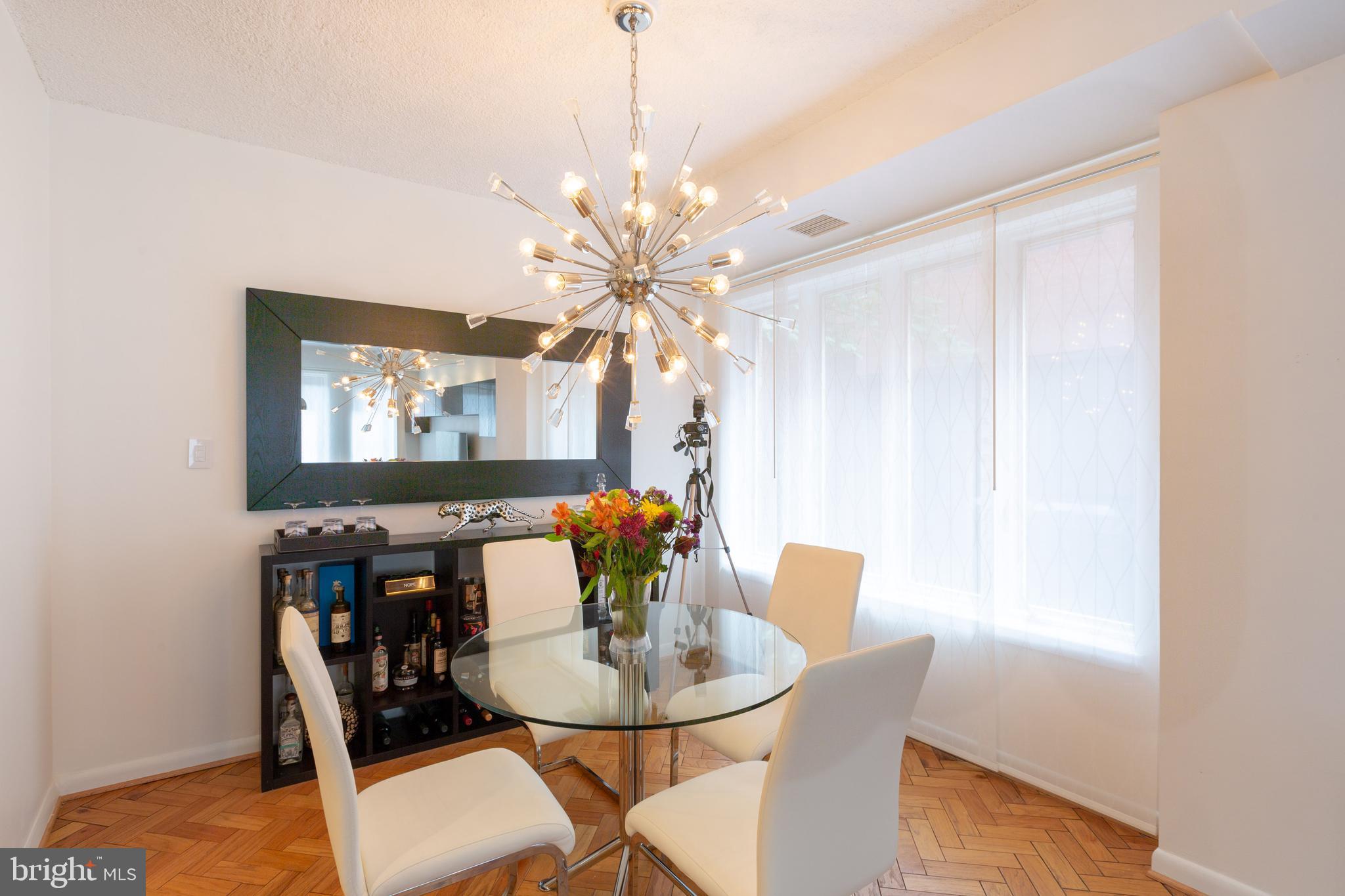 1045 31st Street Northwest, Unit 21 Washington, DC 20007 - Photo 24 of 35 a dining room with furniture and window