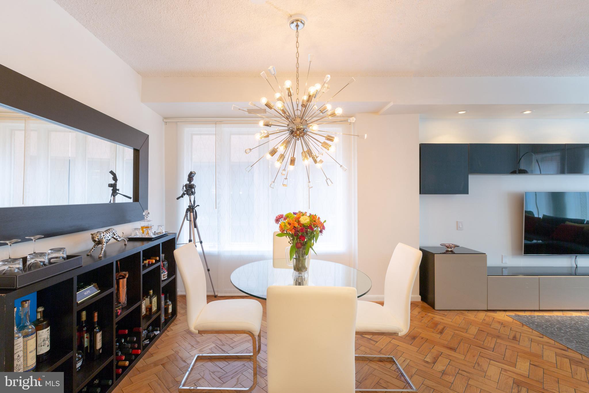 1045 31st Street Northwest, Unit 21 Washington, DC 20007 - Photo 25 of 35 a living room with furniture and a flat screen tv