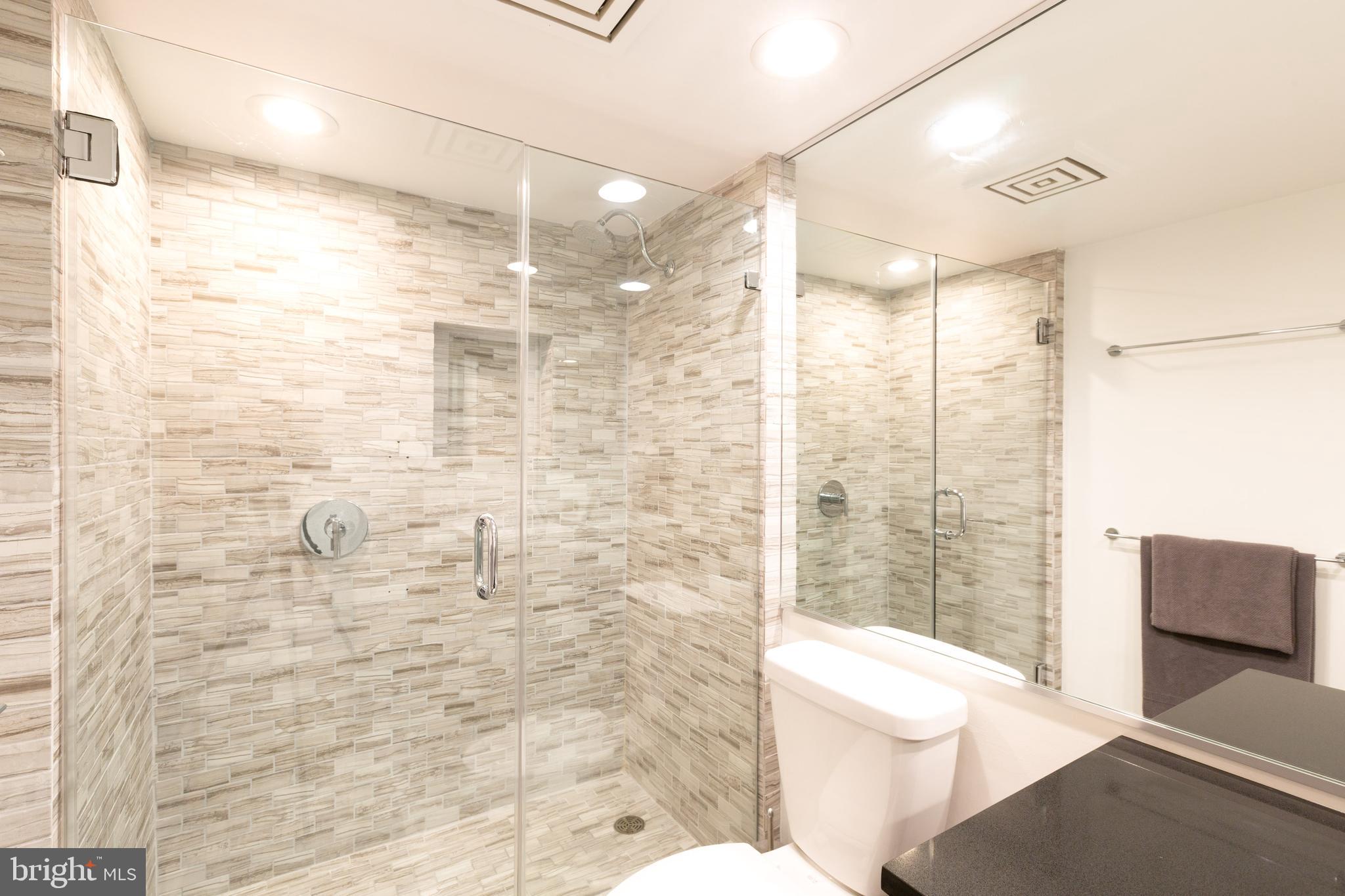 1045 31st Street Northwest, Unit 21 Washington, DC 20007 - Photo 30 of 35 a bathroom with a shower and a toilet