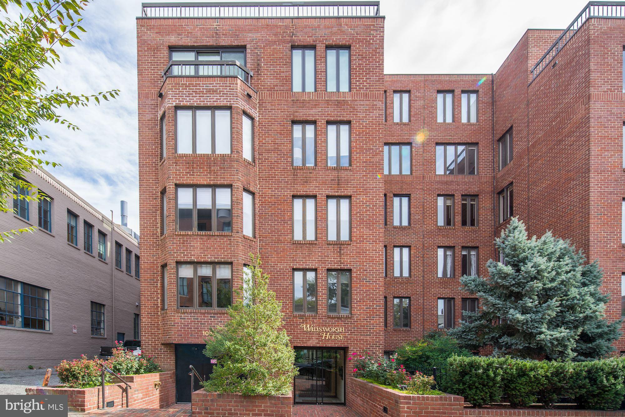 1045 31st Street Northwest, Unit 21 Washington, DC 20007 - Photo 35 of 35 a front view of a multi story building