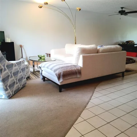 a bedroom with bed and a couch