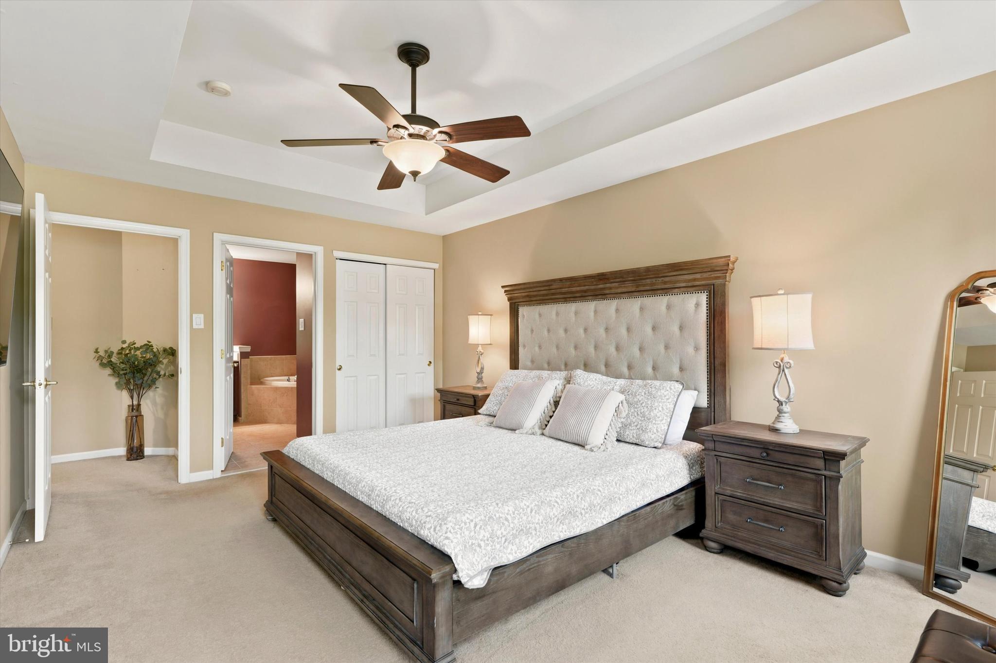 215 Flagstone Road, Unit 1 Chester Springs, PA 19425 - Photo 20 of 33 a bedroom with a bed and a chandelier