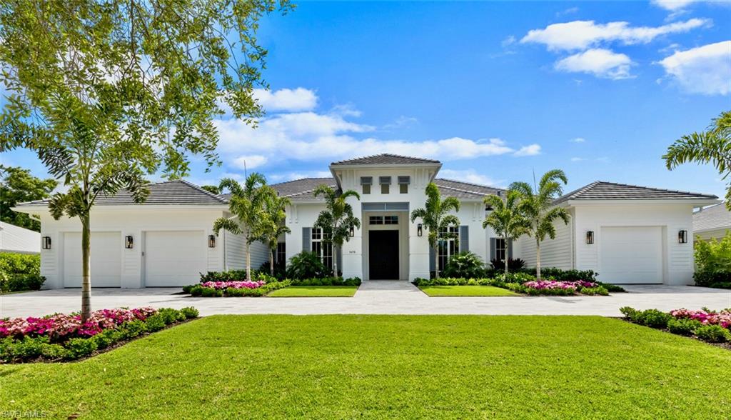 1670 Crayton Road Naples, FL 34102 - Photo 1 of 26 a front view of house with yard