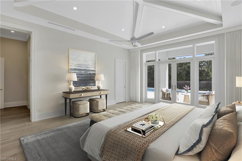 1670 Crayton Road Naples, FL 34102 - Photo 11 of 26 a bedroom with a bed and wooden floor