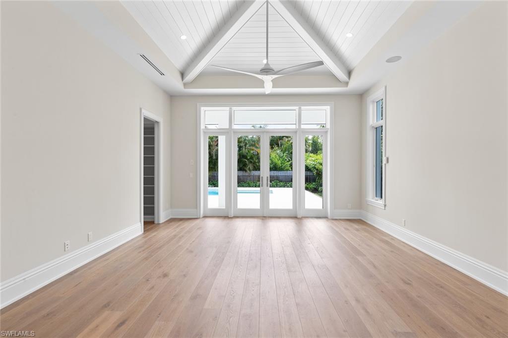 1670 Crayton Road Naples, FL 34102 - Photo 21 of 26 wooden floor in an empty room with a window
