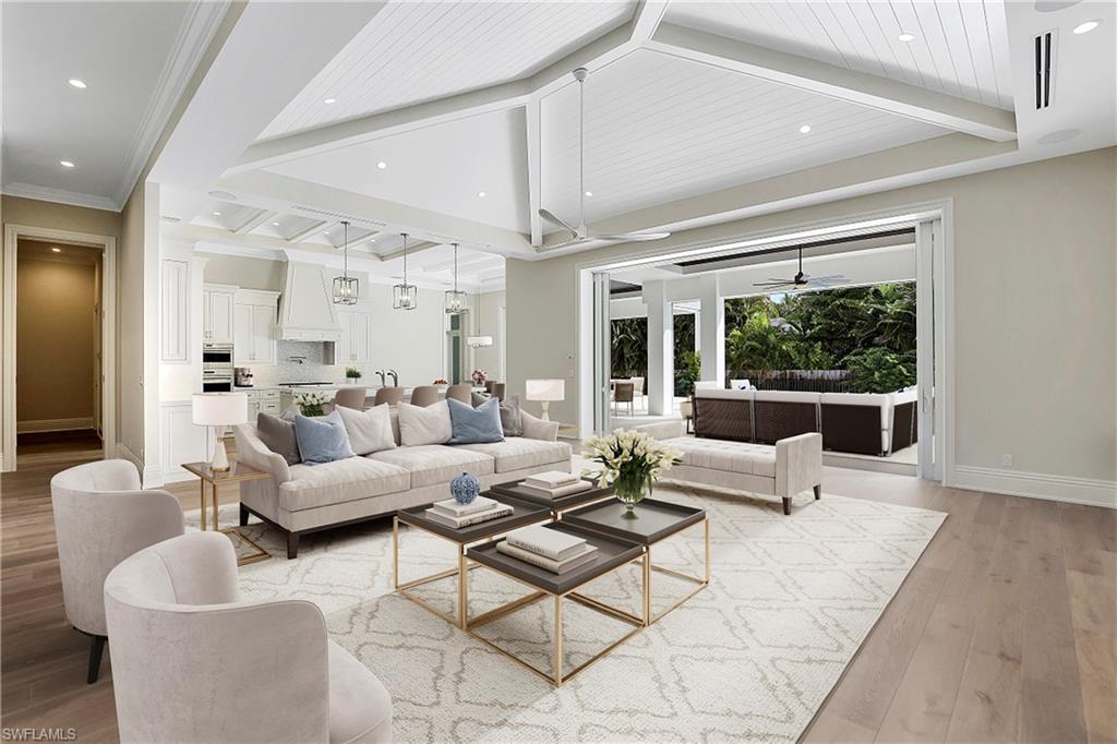 1670 Crayton Road Naples, FL 34102 - Photo 7 of 26 a living room with furniture and a large window