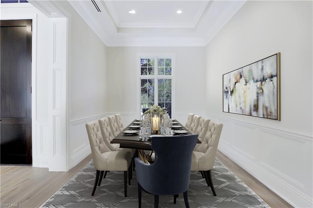 1670 Crayton Road Naples, FL 34102 - Photo 10 of 26 a view of a dining room with furniture and window