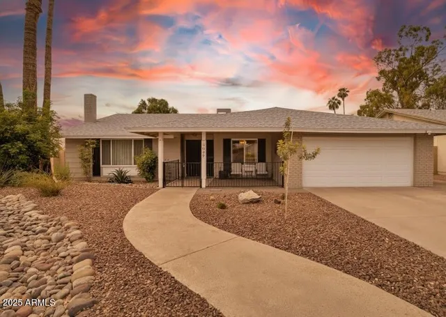 front view of a house with a yard
