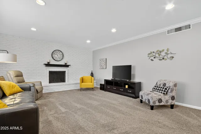 a view of an empty room with closet and a window