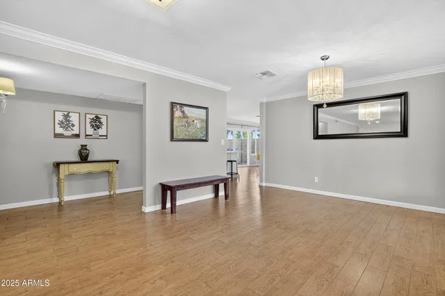 a bedroom with a bed and a chair