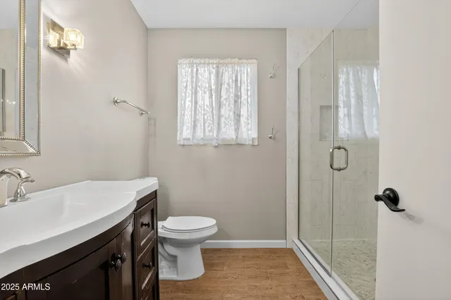 a view of a room with a table and chairs