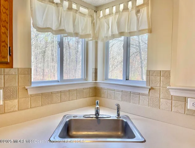 a close up of a stove top oven sitting inside of a kitchen