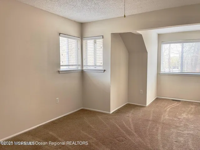 a bathroom with a bath tub with a shower