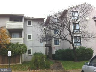 5758 Village Green Drive, Unit E Alexandria, VA 22309 - Photo 2 of 7 a view of a house with a yard