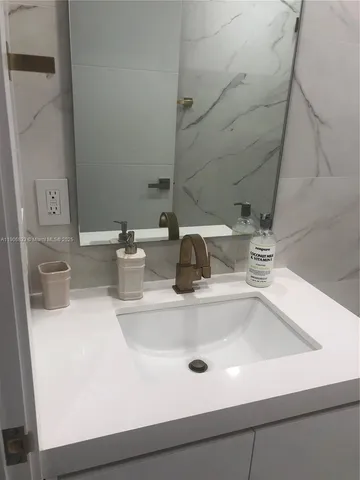 a close view of sink and a vanity
