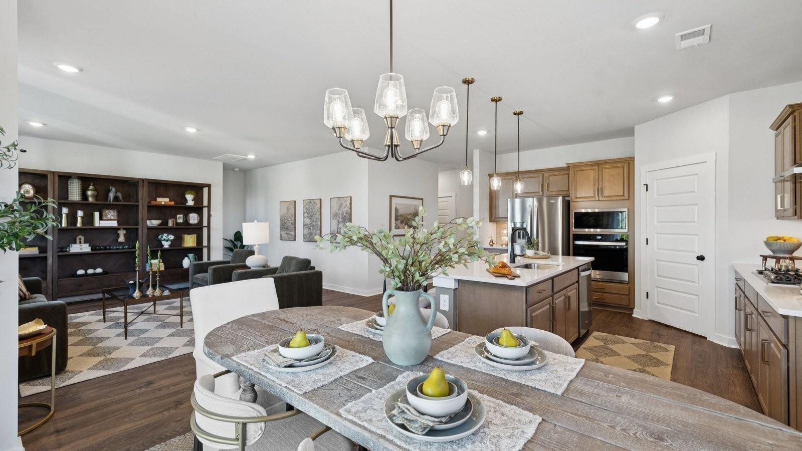 306 Harvest Point Boulevard Spring Hill, TN 37174 - Photo 24 of 70 a view of a dining room with furniture kitchen and wooden floor