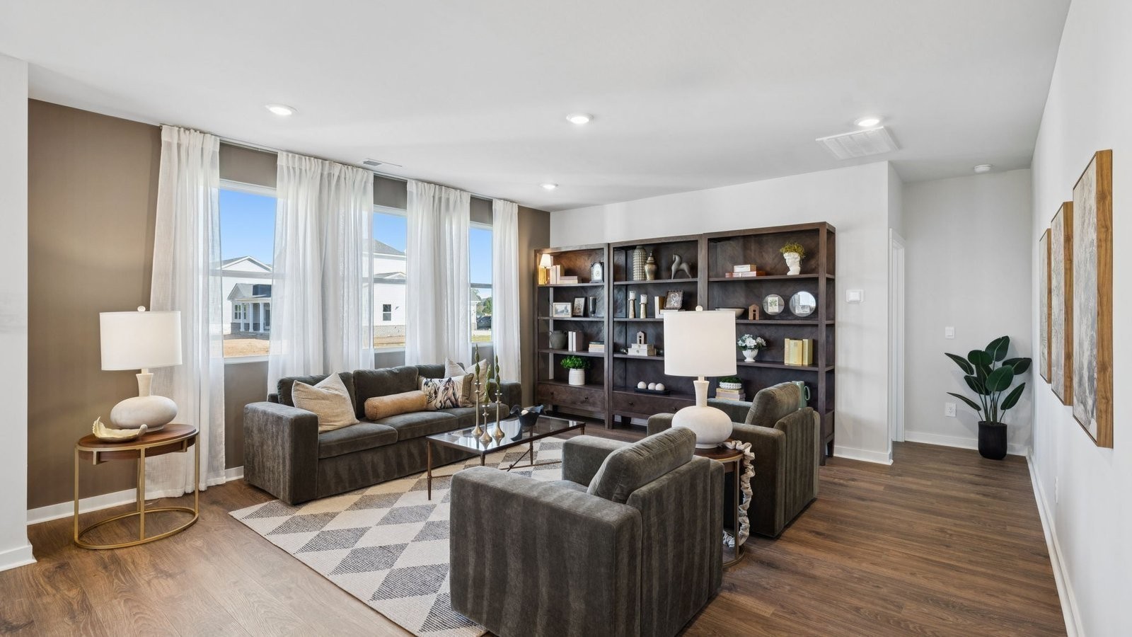 306 Harvest Point Boulevard Spring Hill, TN 37174 - Photo 25 of 70 a living room with furniture potted plant and kitchen view
