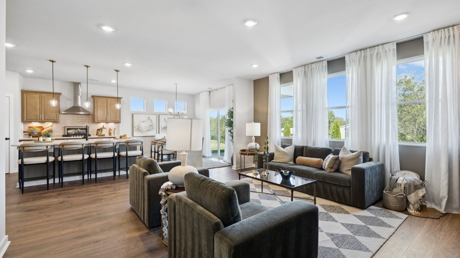 306 Harvest Point Boulevard Spring Hill, TN 37174 - Photo 29 of 70 a living room with lots of furniture and kitchen view