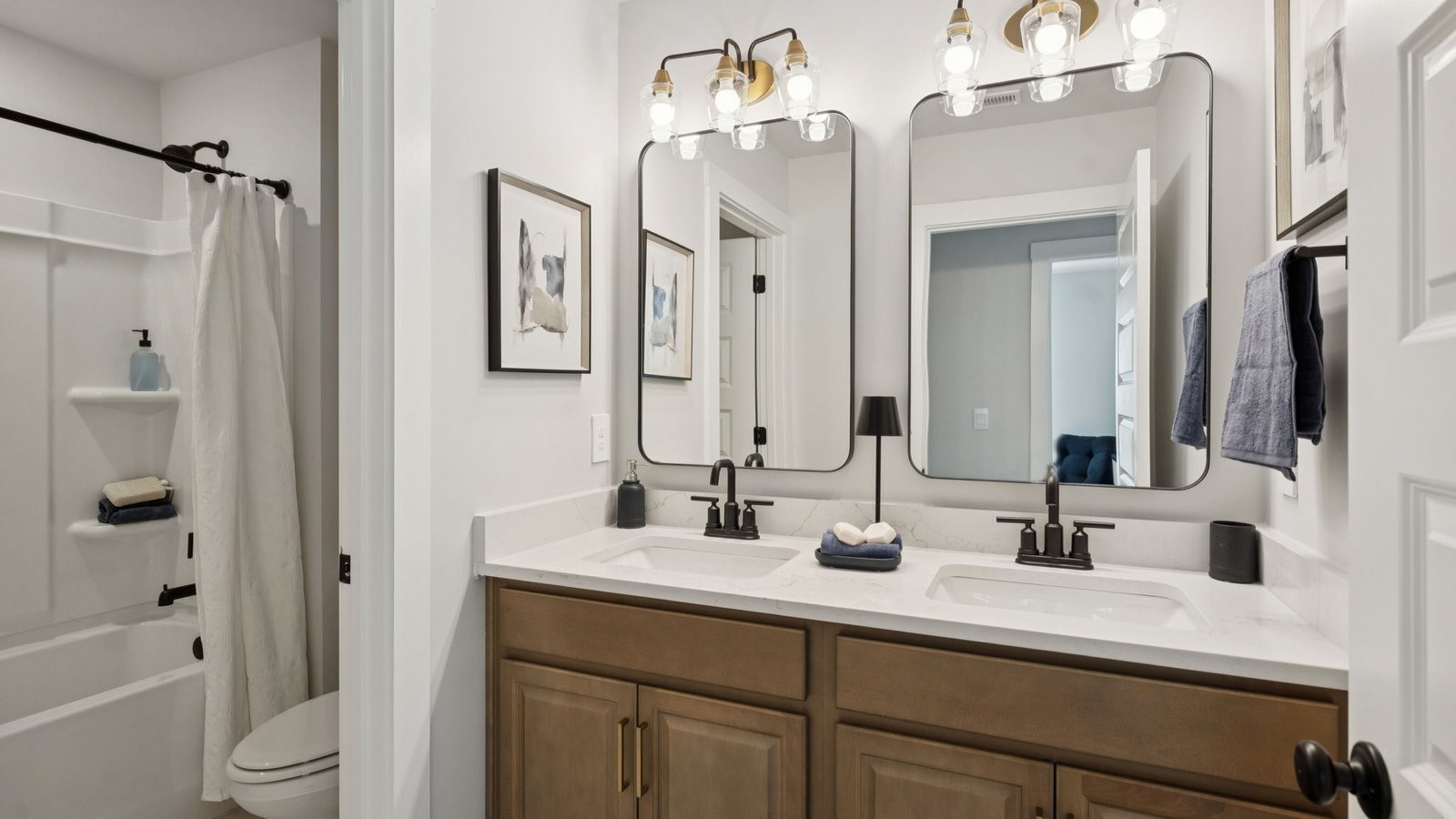 306 Harvest Point Boulevard Spring Hill, TN 37174 - Photo 44 of 70 a bathroom with a double vanity sink mirror double and shower