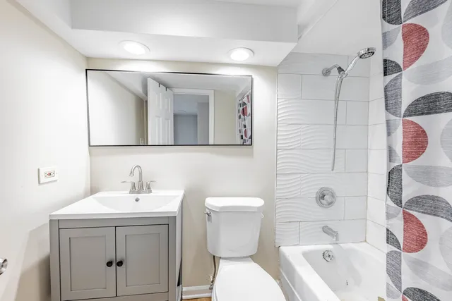 a view of a kitchen with a sink and wooden floor