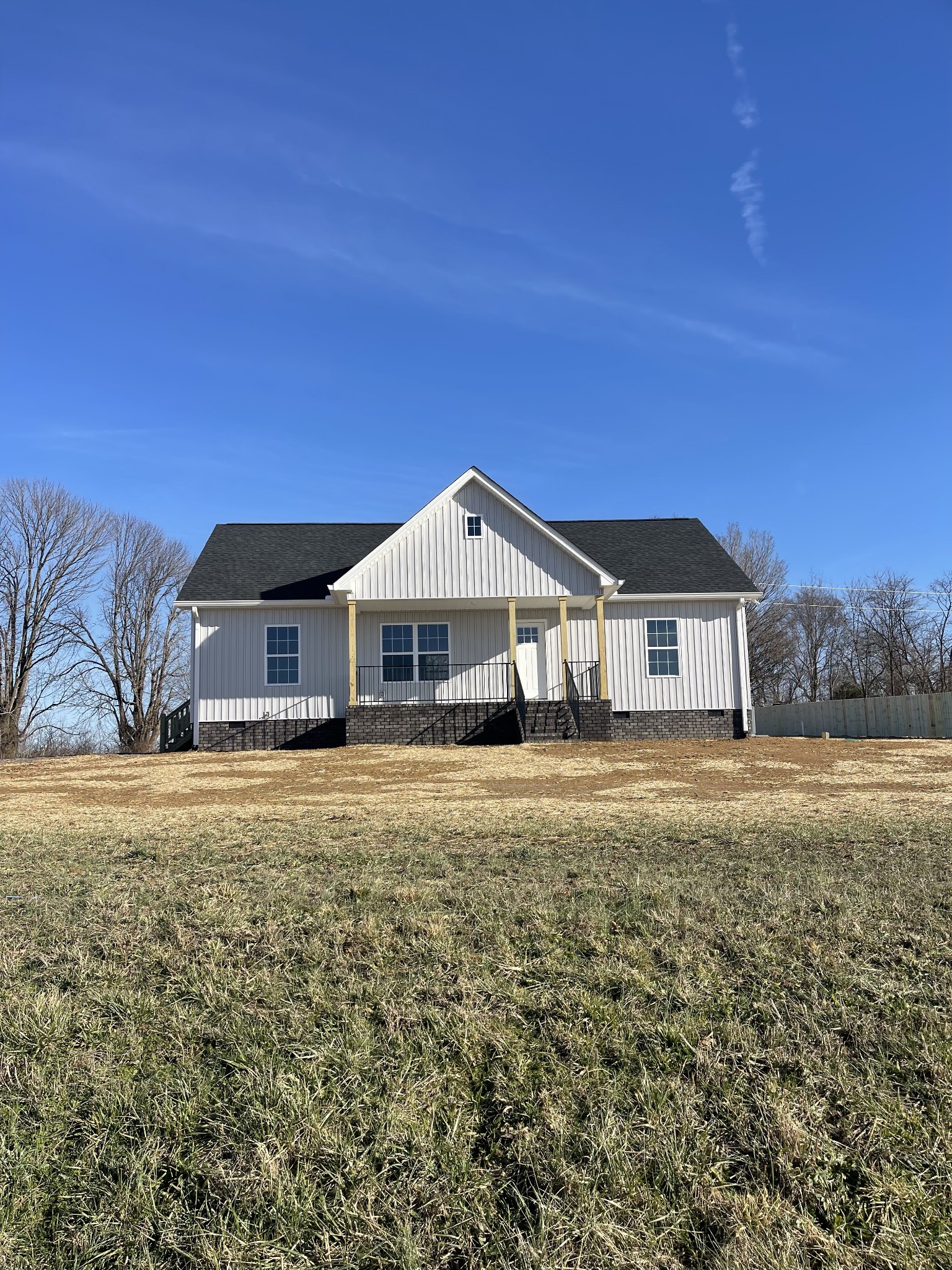 586 Pleasant Hill Road Lafayette, TN 37083 - Photo 1 of 38 a front view of a house with a yard