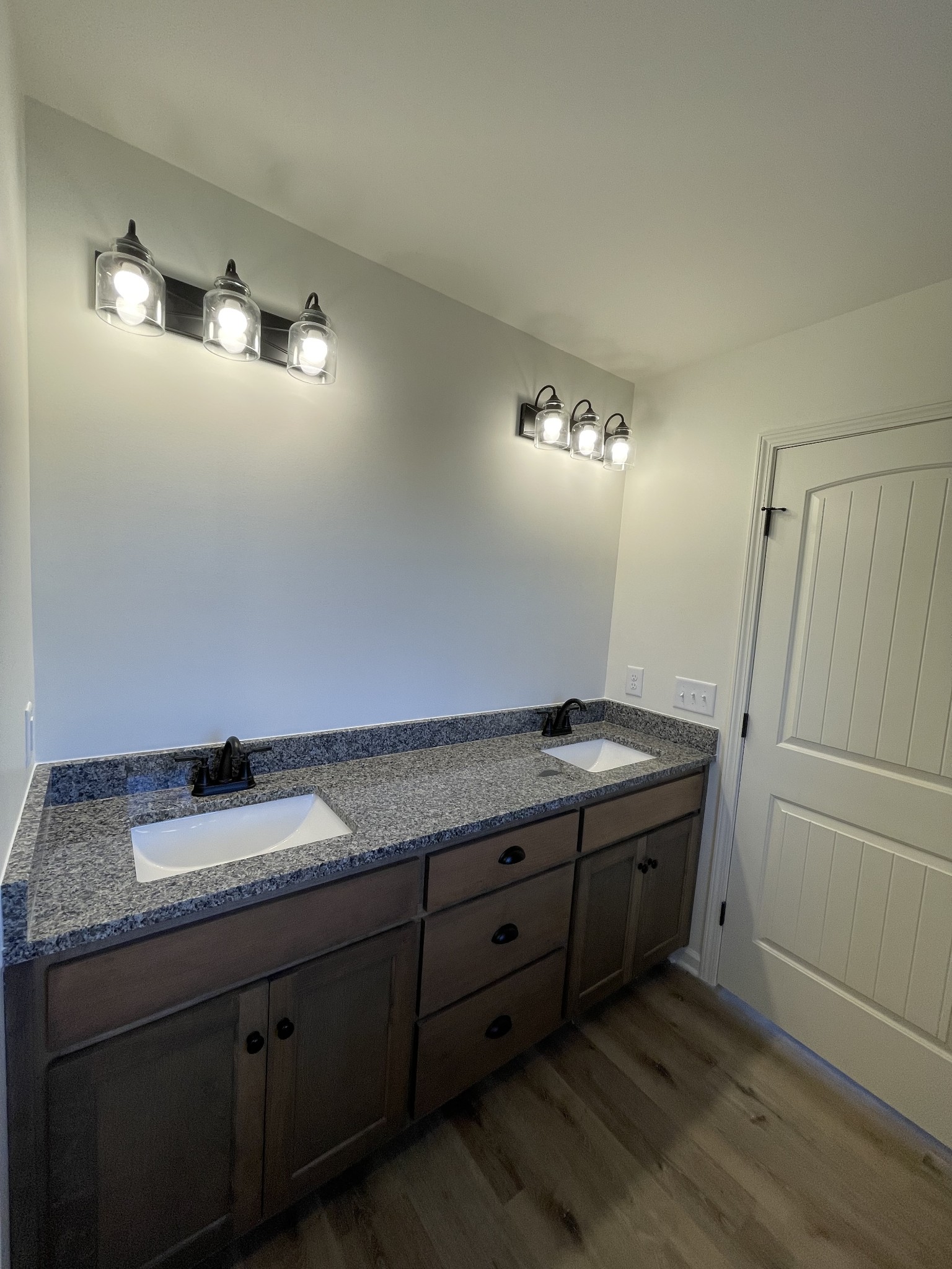 586 Pleasant Hill Road Lafayette, TN 37083 - Photo 17 of 38 a bathroom with a granite countertop sink and a mirror