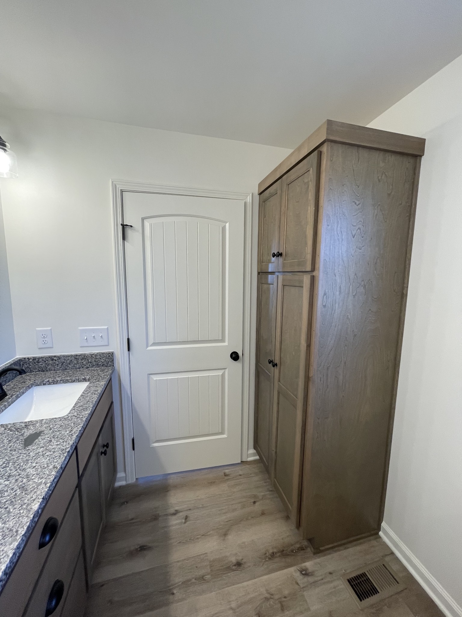 586 Pleasant Hill Road Lafayette, TN 37083 - Photo 20 of 38 a bathroom with a granite countertop sink and a mirror