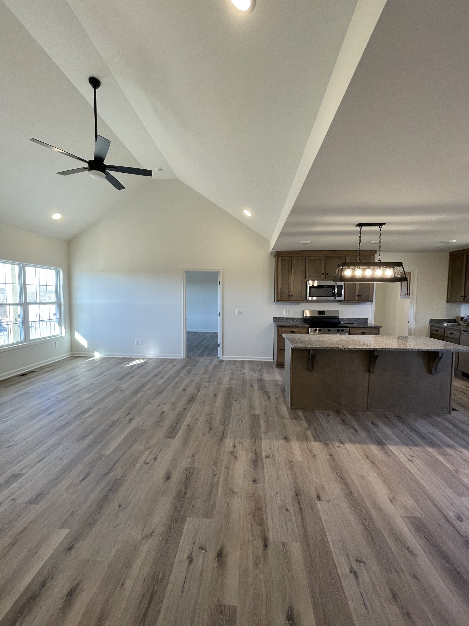 586 Pleasant Hill Road Lafayette, TN 37083 - Photo 29 of 38 a view of kitchen with sink microwave and stove