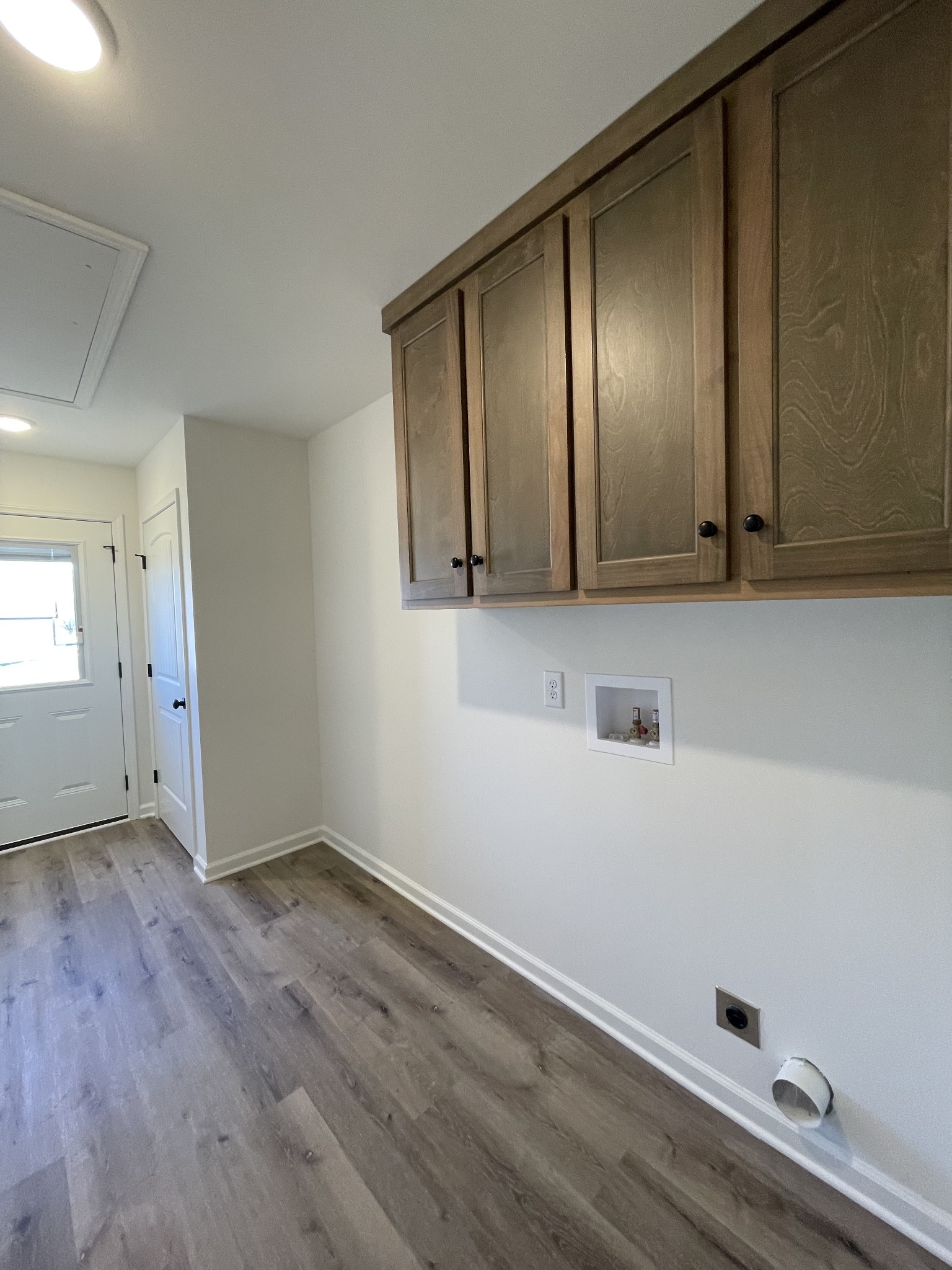 586 Pleasant Hill Road Lafayette, TN 37083 - Photo 30 of 38 a view of an empty room with wooden floor