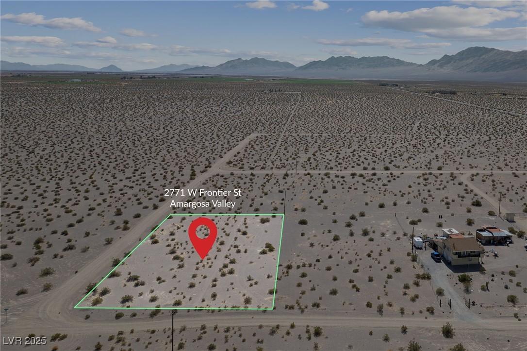 2972 West Old West Road Amargosa Valley, NV 89020 - Photo 11 of 59 Aerial view featuring a rural view and a mountain