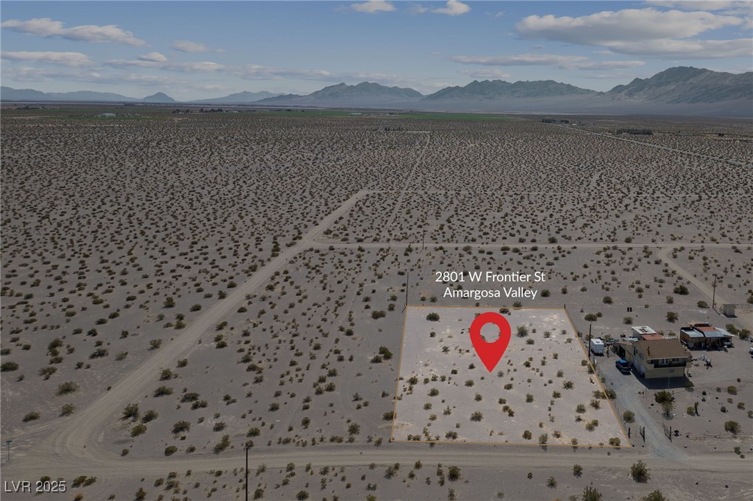 2972 West Old West Road Amargosa Valley, NV 89020 - Photo 17 of 59 Drone / aerial view featuring a mountain view
