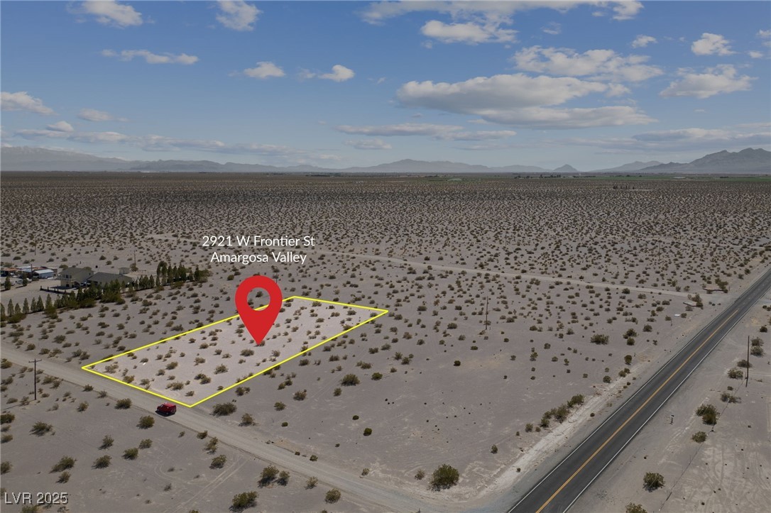2972 West Old West Road Amargosa Valley, NV 89020 - Photo 25 of 59 Aerial view featuring a mountain view