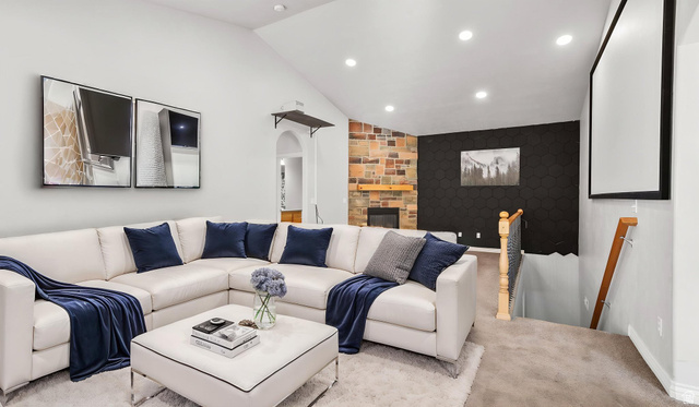 45 North 970 W Street Orem, UT 84057 - Photo 4 of 45 Living room with large projector screen and gas fireplace (virtual staging)