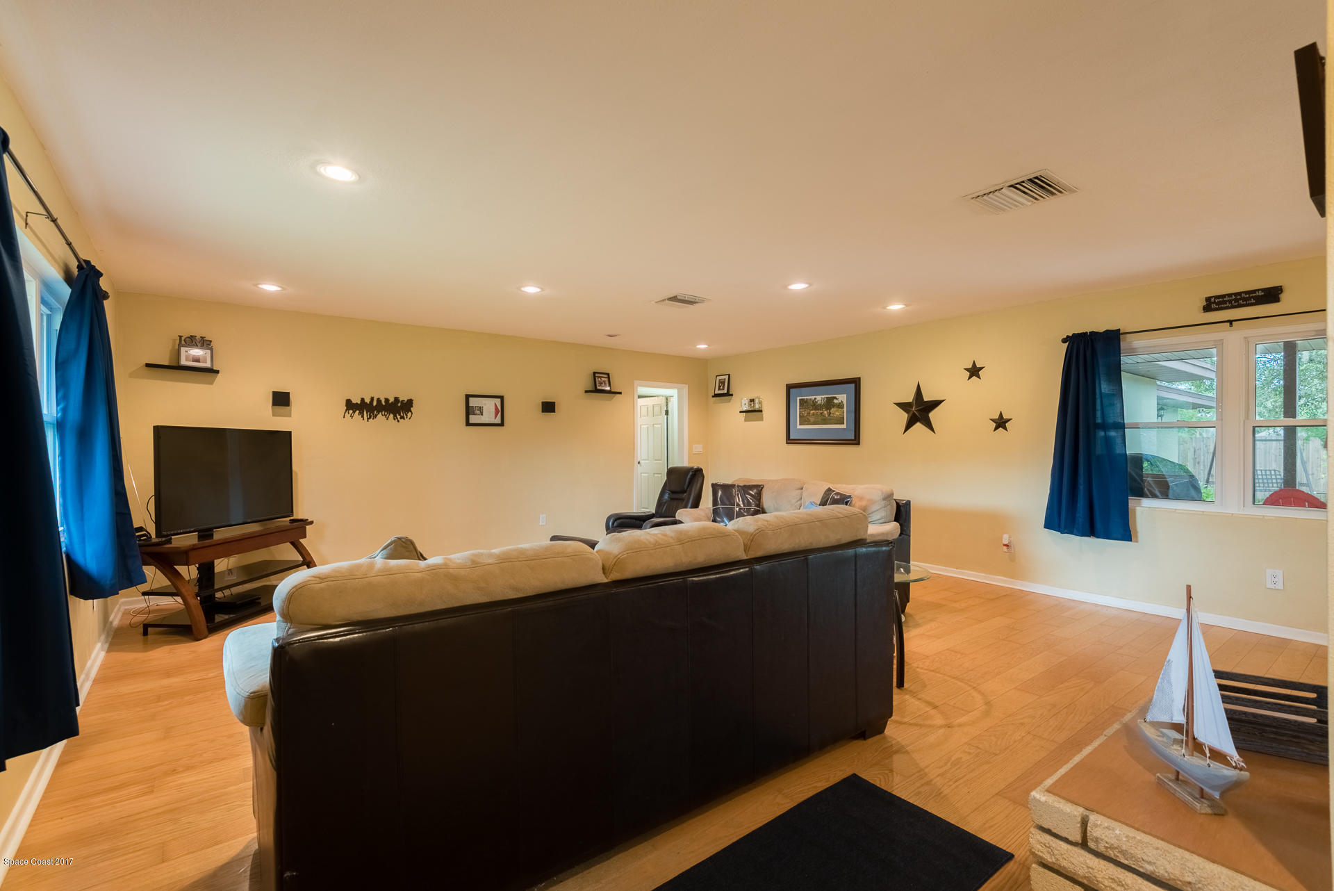 3635 Montgomery Road Mims, FL 32754 - Photo 8 of 19 a living room with furniture and a flat screen tv