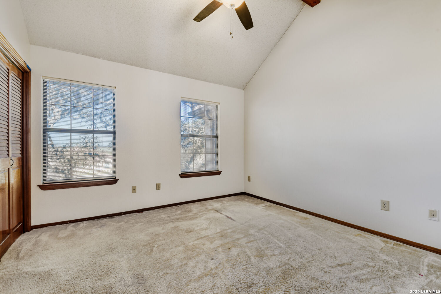 29342 Seabiscuit Drive Fair Oaks Ranch, TX 78015 - Photo 15 of 45 an empty room with windows and fan