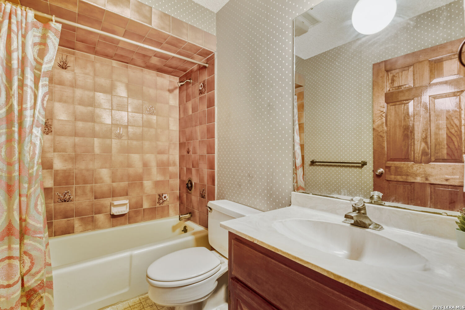 29342 Seabiscuit Drive Fair Oaks Ranch, TX 78015 - Photo 16 of 45 a bathroom with a sink a toilet and a bathtub