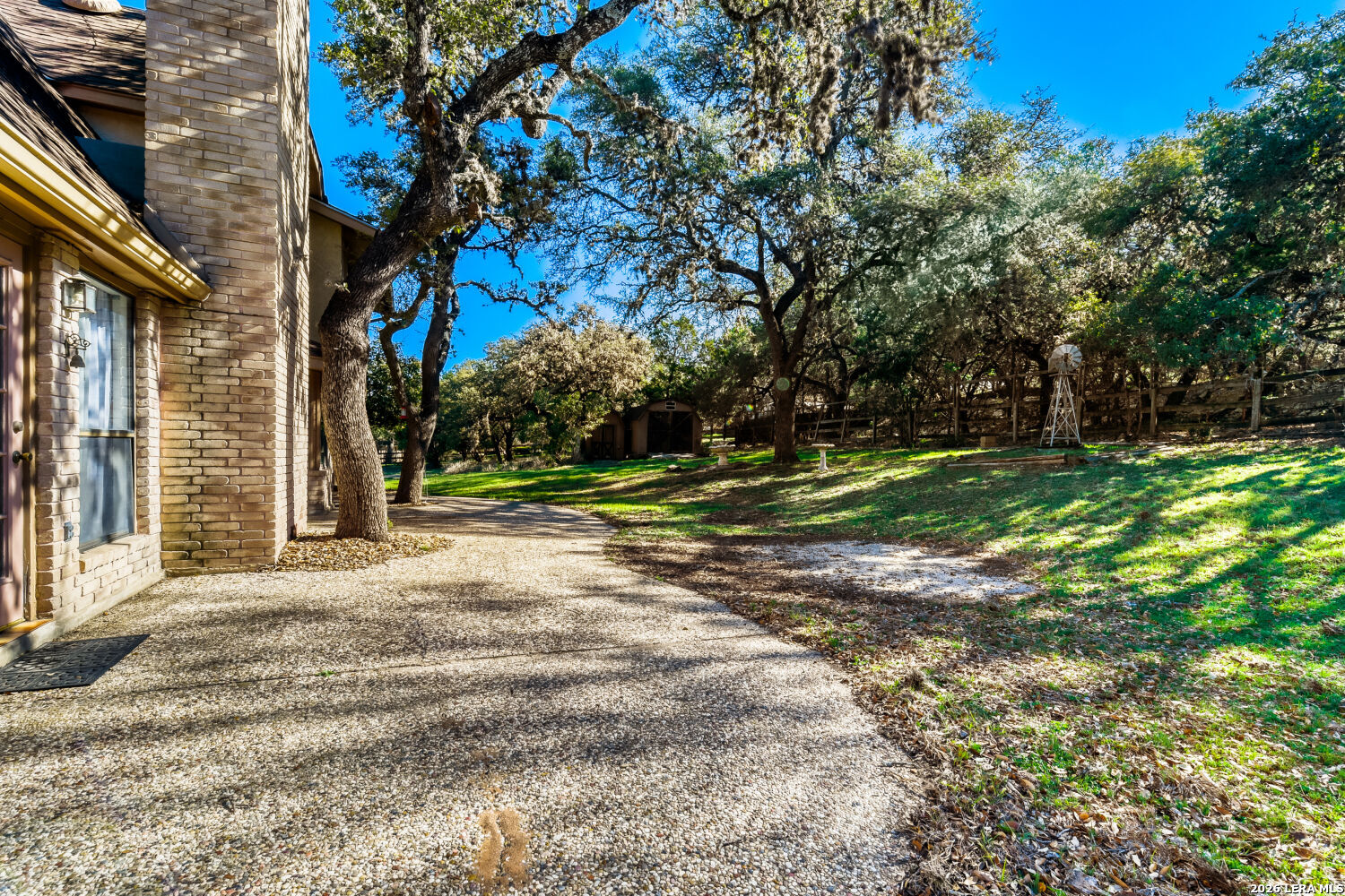 29342 Seabiscuit Drive Fair Oaks Ranch, TX 78015 - Photo 21 of 45 a backyard of a house with lots of green space
