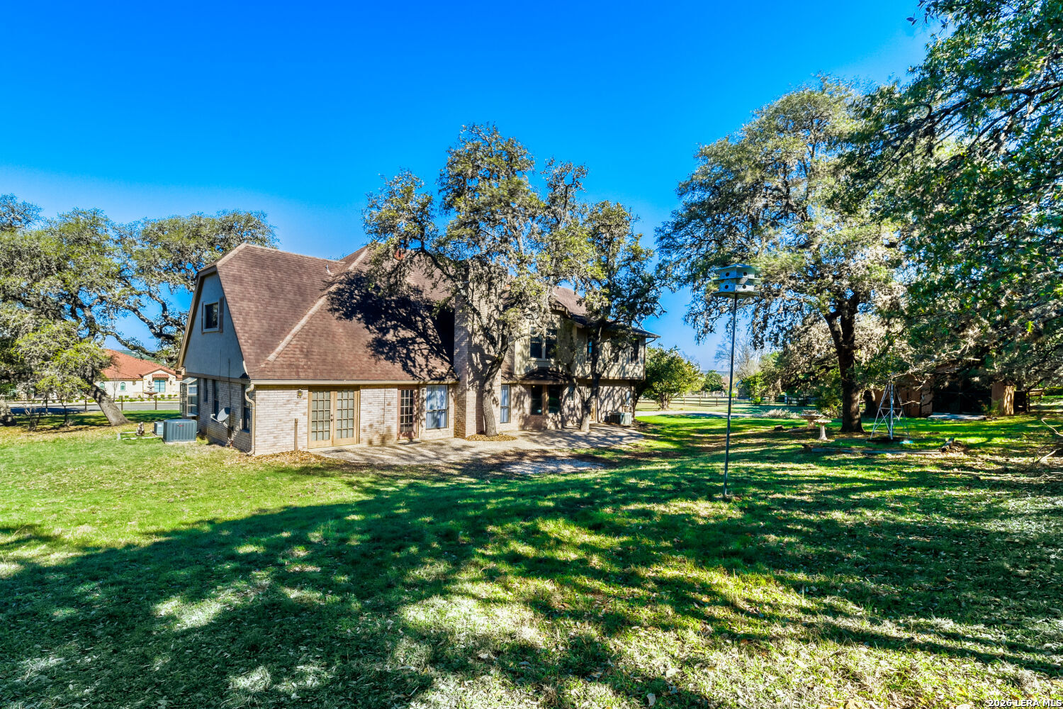 29342 Seabiscuit Drive Fair Oaks Ranch, TX 78015 - Photo 22 of 45 a front view of a house with a yard