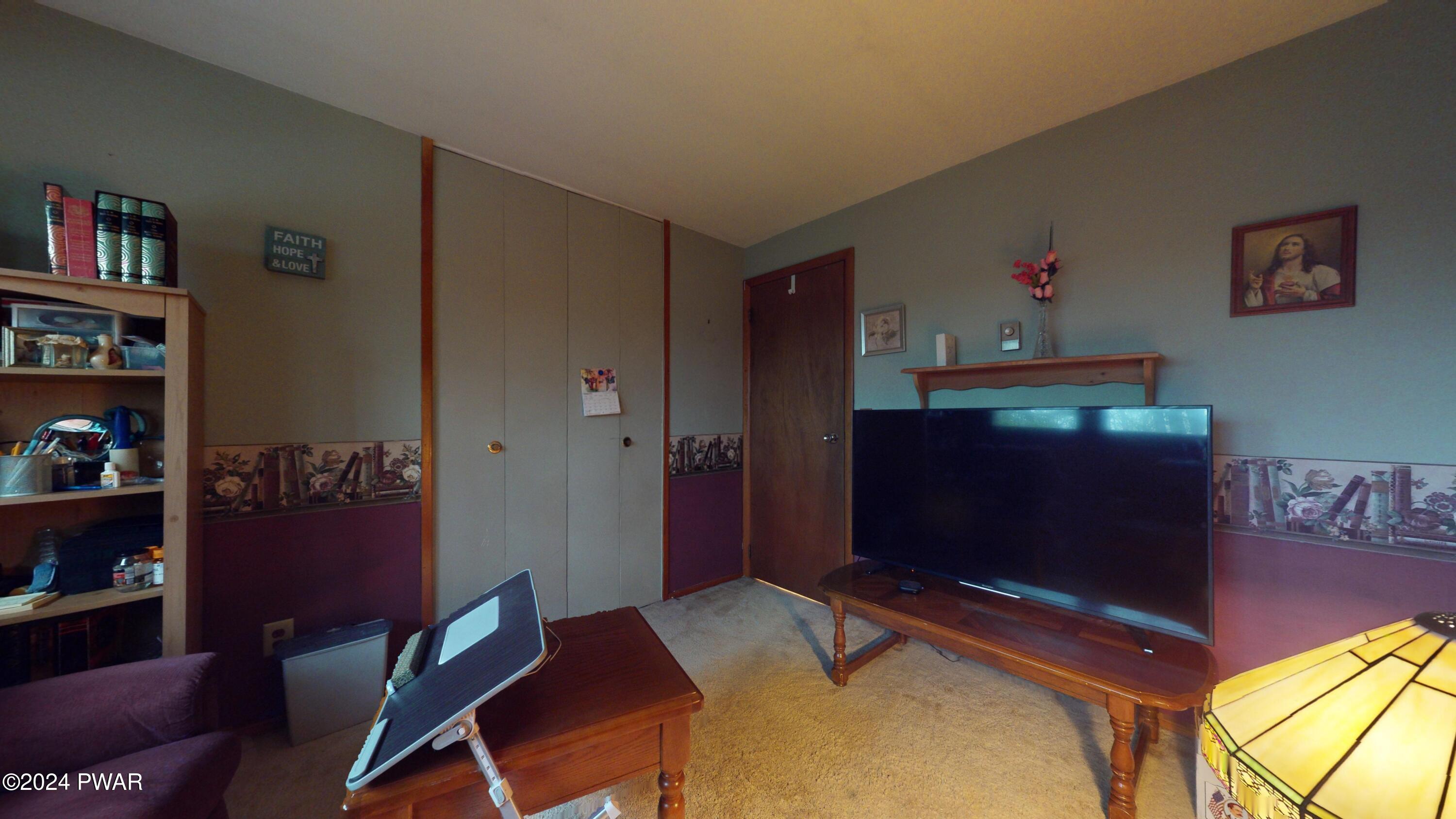 134 Sunnylands Road Milford, PA 18337 - Photo 53 of 59 a room with furniture and a flat screen tv