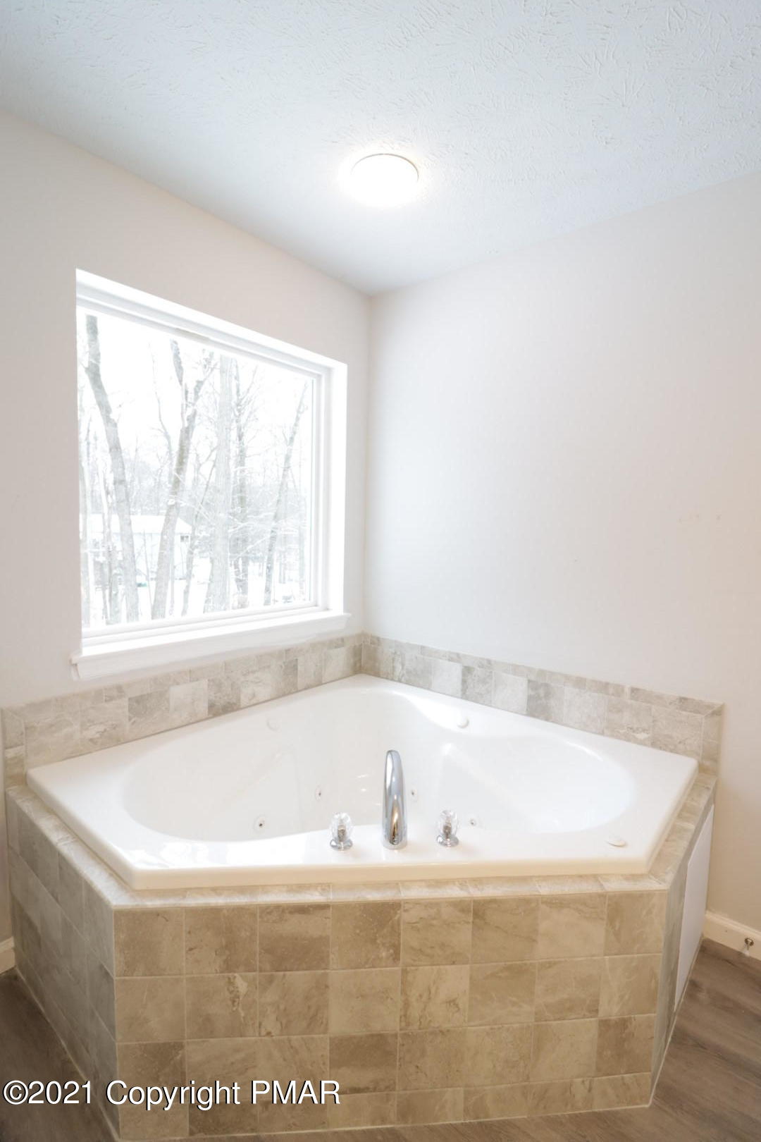 3340 Oberon Road Tobyhanna, PA 18466 - Photo 42 of 51 a bath tub sitting in a bathroom next to a window