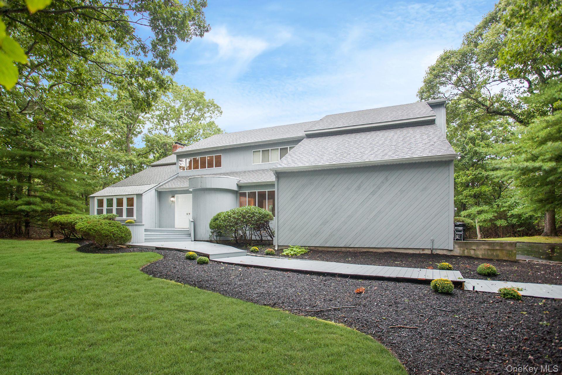 12 North Ridge Road Setauket, NY 11733 - Photo 2 of 34 a view of house with backyard and garden