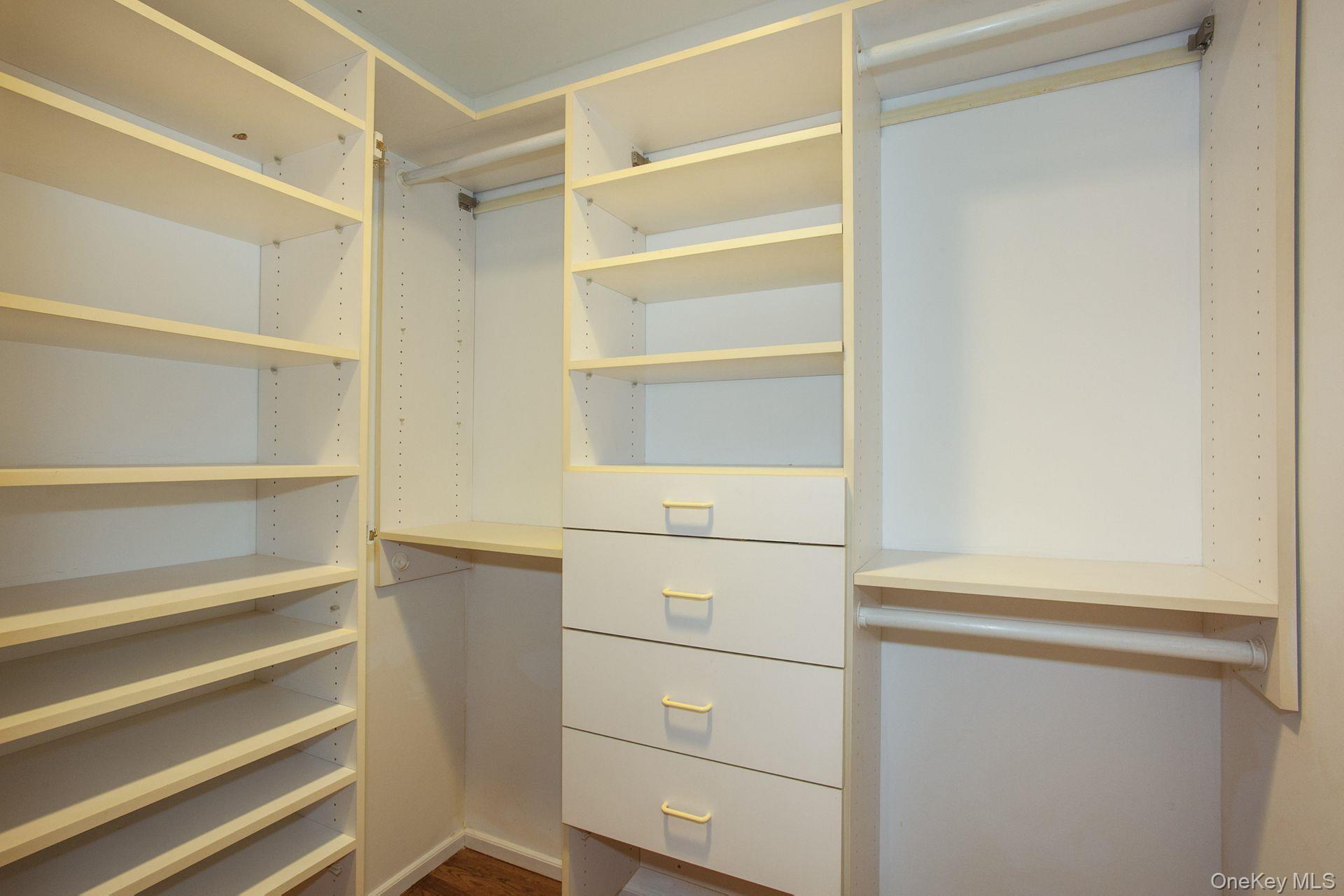 12 North Ridge Road Setauket, NY 11733 - Photo 25 of 34 a view of walk in closet with empty racks