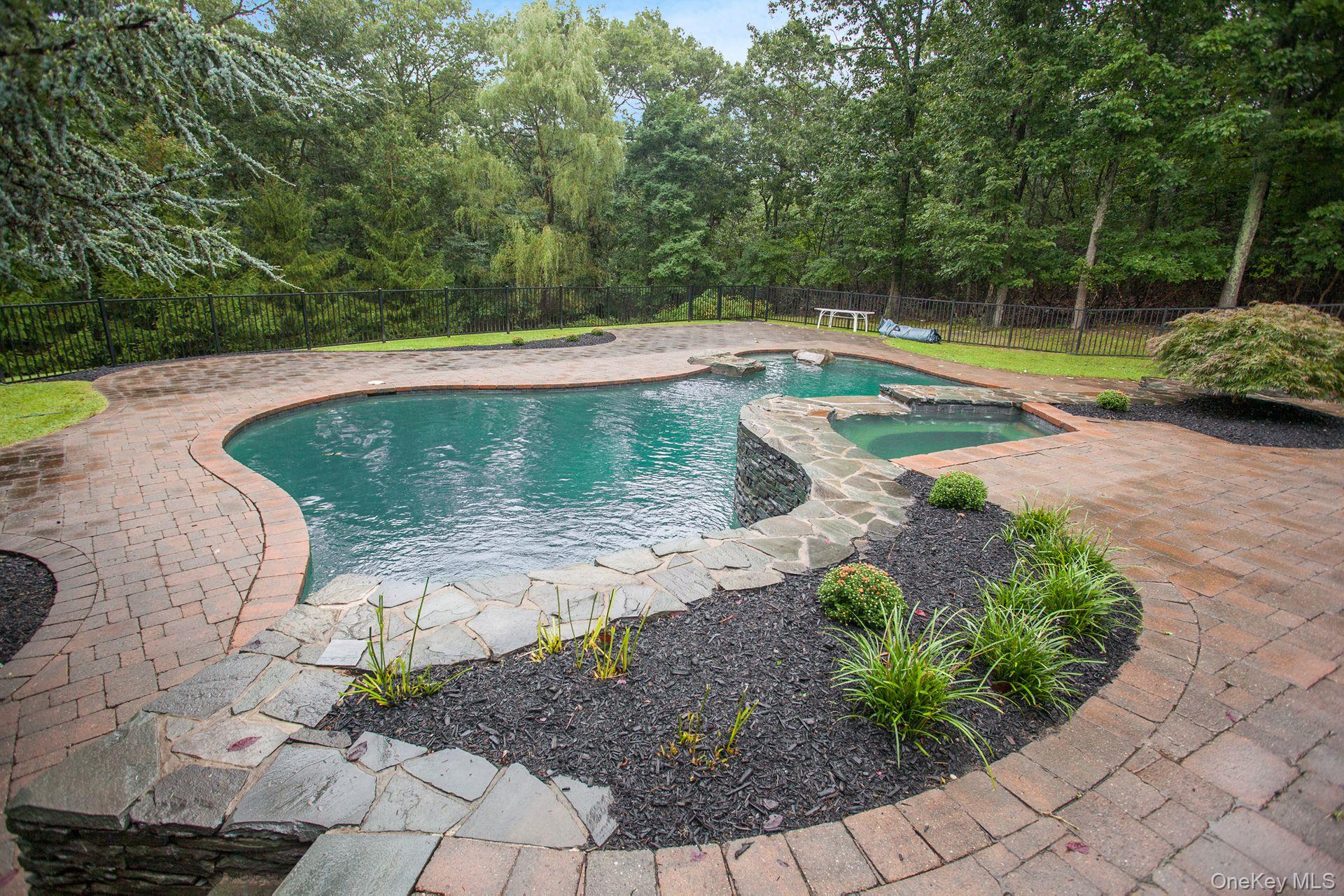 12 North Ridge Road Setauket, NY 11733 - Photo 31 of 34 a view of a backyard with swimming pool