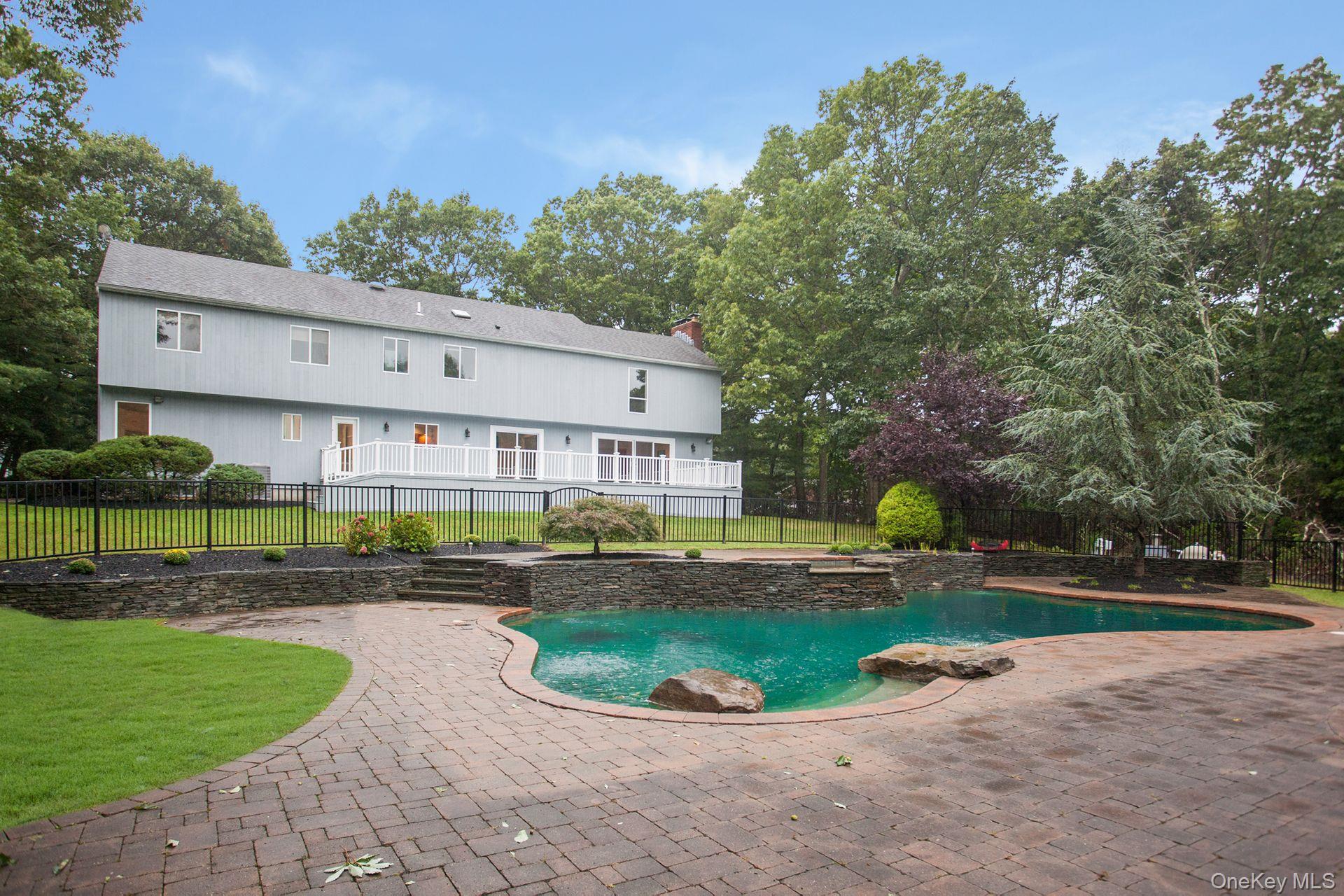 12 North Ridge Road Setauket, NY 11733 - Photo 33 of 34 a view of a big house with a big yard and potted plants