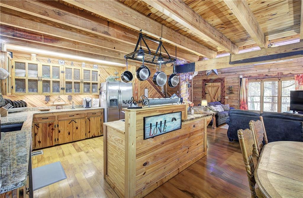 647 Knight Bottom Road Fairmount, GA 30139 - Photo 11 of 62 a view of a kitchen with stainless steel appliances granite countertop a stove and a large window